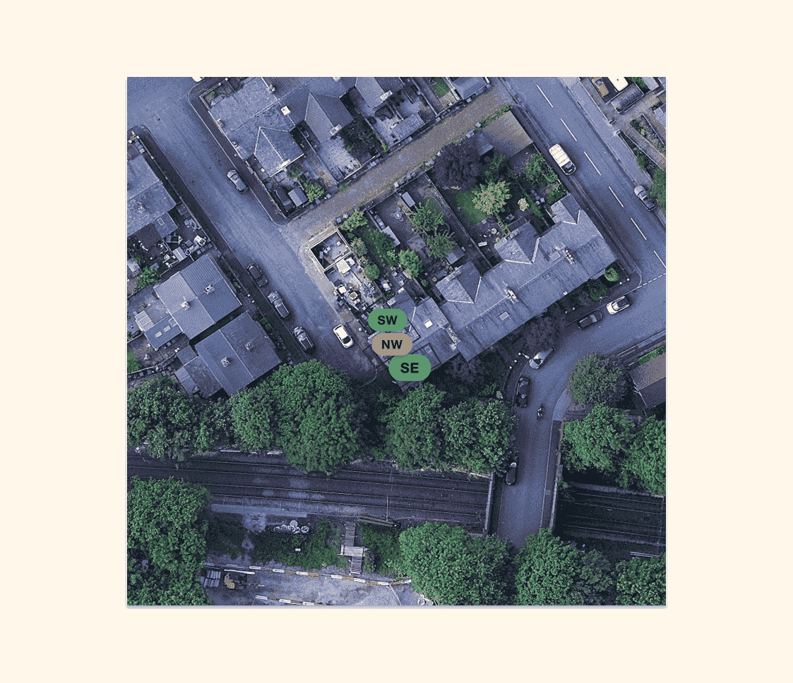 An aerial view of a UK terraced street showing rooftops from directly above